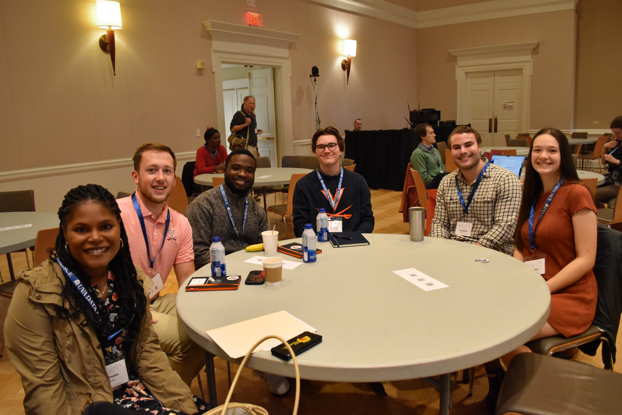 PhD Students at Datapalooza 2023 sitting around a table in UVA Newcomb Ballroom