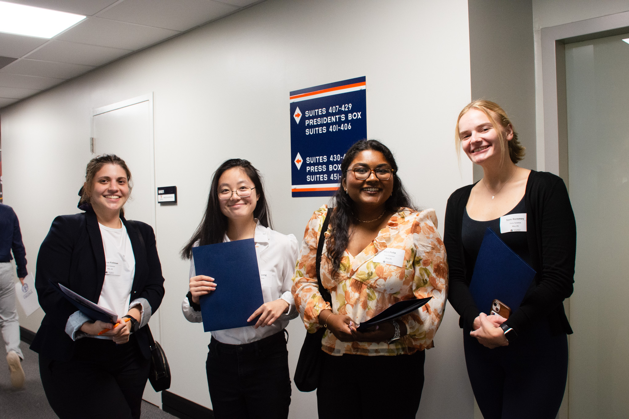 A group of four MSDS students pose together for a photo.