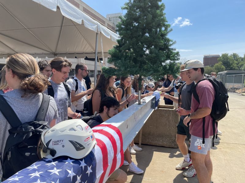 students signing beam