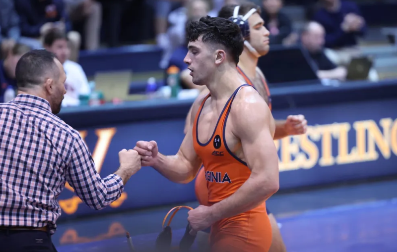 Wrestler Neil Antrassian and Head Coach Steve Garland