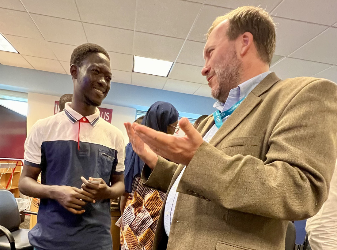 Brandtly Jones, right, speaks with a student during a trip to Abidjan, Côte d'Ivoire, as a member of the U.S. Digital Corps (photo provided by Brandtly Jones).