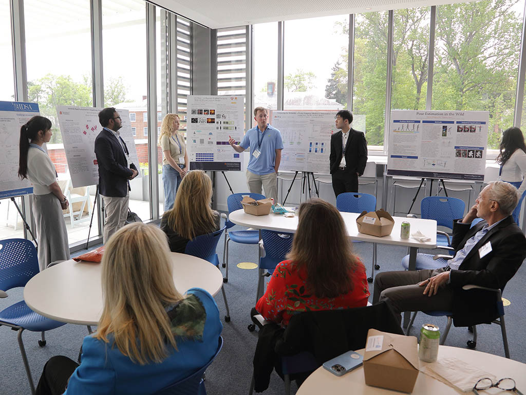 UVA data science PhD students present their research posters to faculty and board members