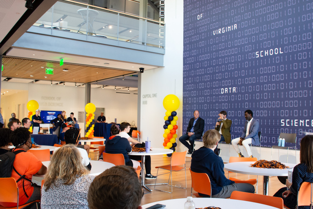 Students, parents, and faculty sit in the Capitol One Hub before the panel of speakers, Jeffrey Blume, Alec Gosse, and Prince Afriyie