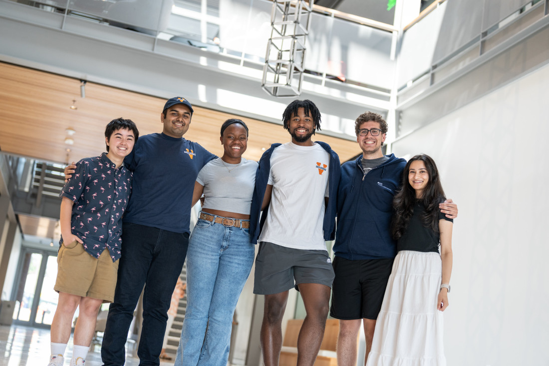 MSDS student ambassador photo in the main floor of the Data Science building.