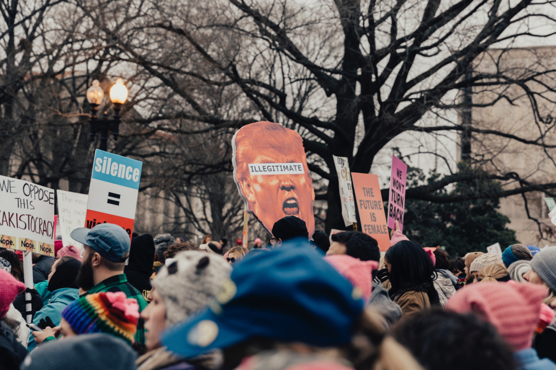 Protestors holding signs