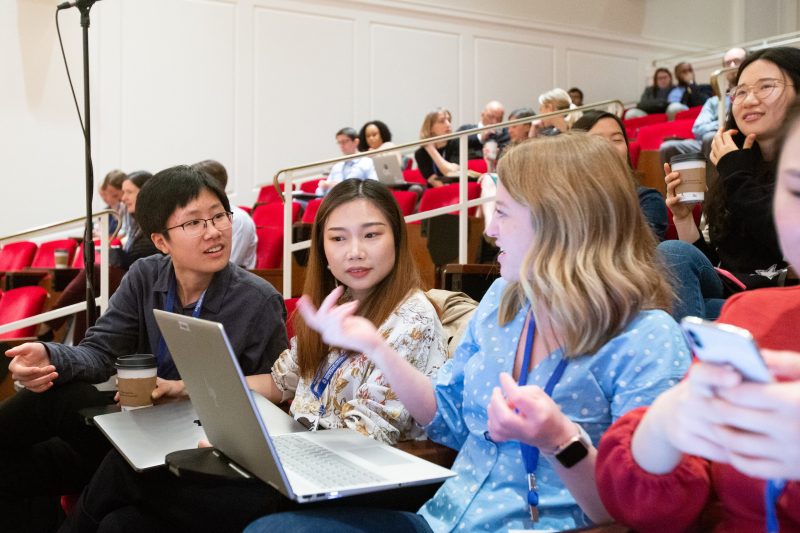 Women discussing in a lecture hall