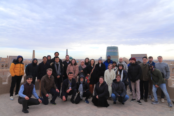 Students invited to a data science conference in Uzbekistan pose for a group picture. 