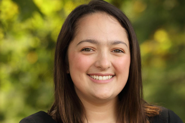 Sara Koochagian UVA MSDS Graduate headshot dressed in black outside