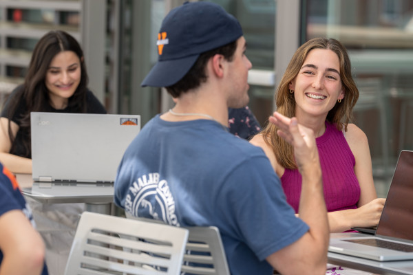 UVA Data Science Ambassador Mercedes Mora-Figueroa de Linan on terrace outside studying with classmates