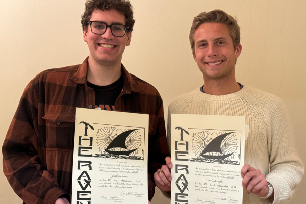 UVA Data Science MSDS residential students, two males, side by side with their Raven Society certificates.