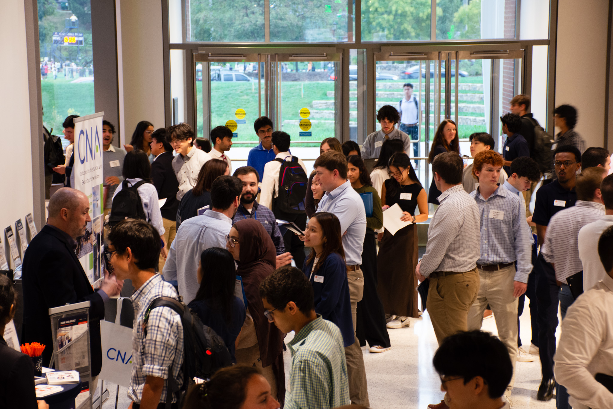 UVA Data Science building lobby full of people attending Data Science and Analytics Night 2025