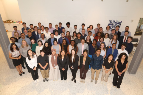 UVA Data Science MSDS class of 2025 group photo standing in data science building lobby