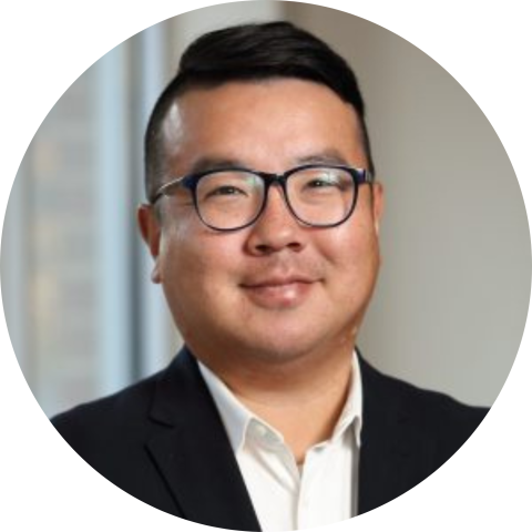 Stephen Baek in suit and glasses professional headshot circle crop