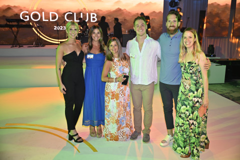 A group of young professionals posing for a picture at Microsoft Gold Club Awards