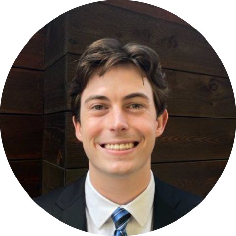 UVA Data Science MSDS alumni  Michael Vaden in a suit and tie circle crop image